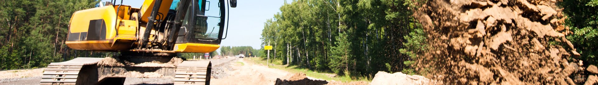 Close up of tractor dumping dirt