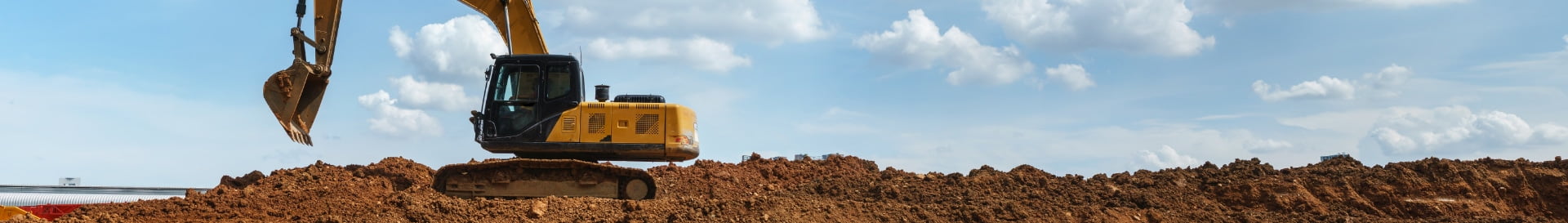 Tractor digging dirt